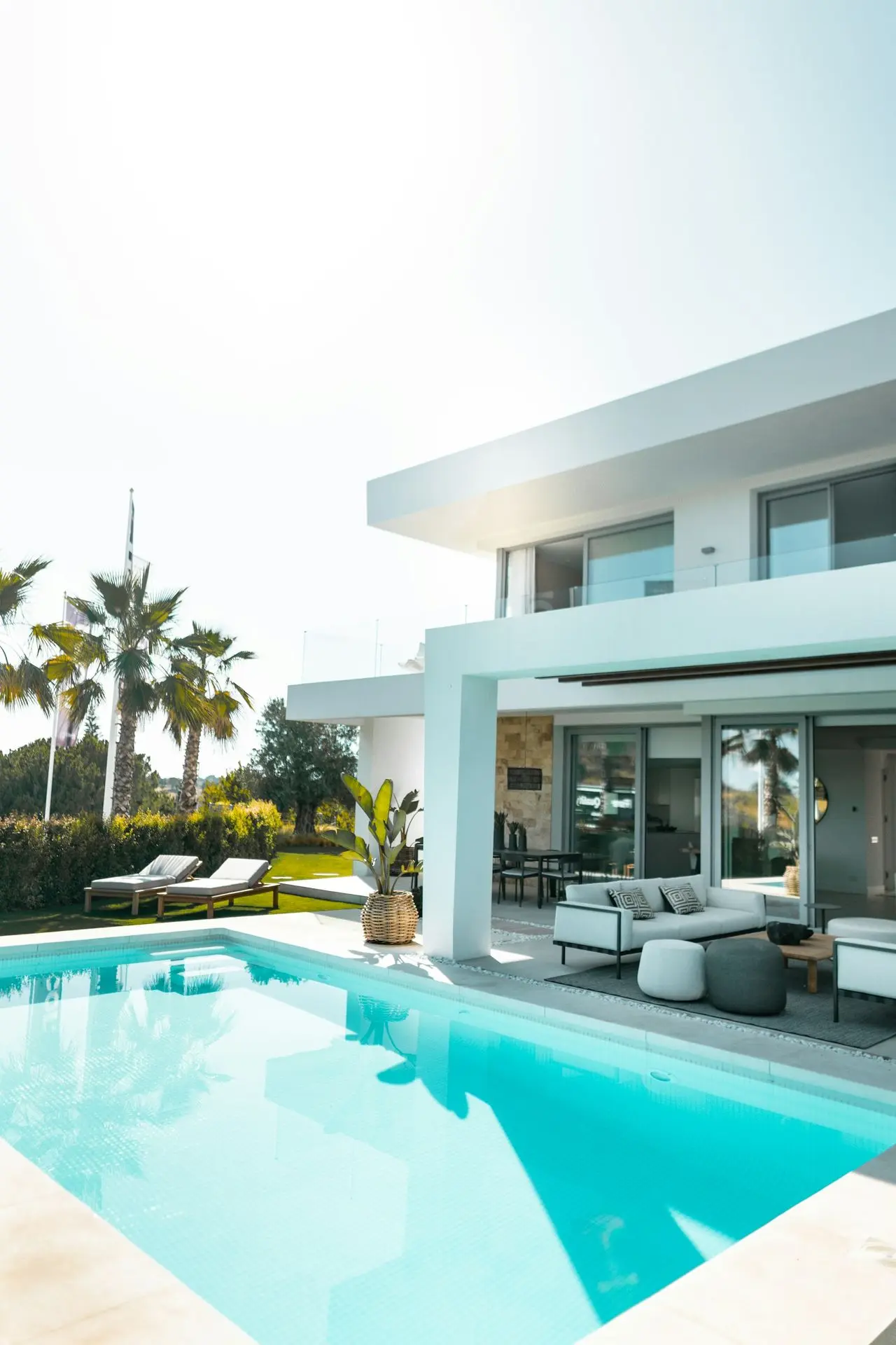 white concrete building with swimming pool